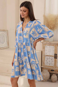 iris maxi loose fitting dress with loose bell sleeve button through front palm print fabric side view 