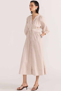 staple the lablel 3/4 sleeve slight puff sleeve dress. Midi length with gather in waist. side view 